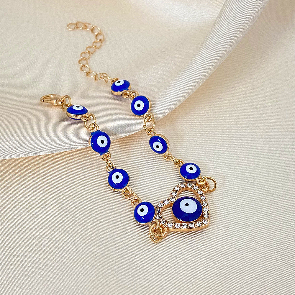 Wholesale Devil's Eye Hollow Diamond Heart Drip Oil Eye Alloy Bracelet